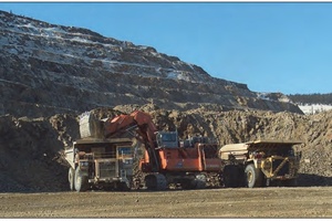 Excavator and Haul Trucks Working in the Fort Knox Pit