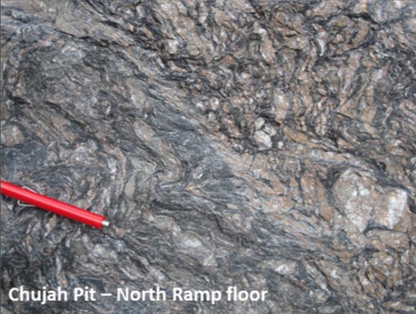 Mineralized graphitic shear zone characterized by quartz vein boudins and ankerite alteration