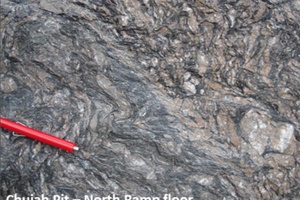 Mineralized graphitic shear zone characterized by quartz vein boudins and ankerite alteration